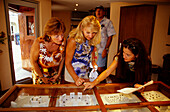 Women looking at jewellery in a Pearl Shop, Papeete, Tahiti, Windward Islands, French Polynesia, South Pacific