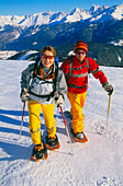 Young couple snowshoeing, Serfaus, Tyrol, Austria