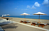 Sun loungers at the deserted beach of the Chedi Hotel, Muscat, Oman