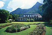 Historical colonial style house and garden in front of a mountain, Eureka, Mauritius, Africa