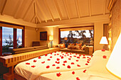 Flower covered bed at the bedroom of the Royal Villa, Hotel Oberoi, Mauritius