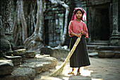 Sweeping Ta Prom temple, Angkor, Siem Raep Cambodia, Asia