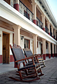 Rocking chairs on empty street, Creel, Chihuahua, Mexico