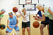 Mature People playing basketball