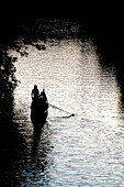 Lonely gondolier rowing on Elster river, Leipzig, Saxony, Germany