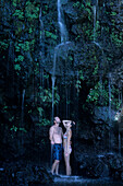 Couple in Blue Pool, Wainapanapa Coastline, Maui, Hawaii, USA