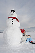 Girl 5-6 Years, lean against snowman