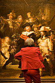 Visitor, Painting, The Nightwatch, Rijksmuseum, Visitor looking at painting The Nightwatch by Rembrandt, rear view, Rijksmuseum, Amsterdam, Holland, Netherlands