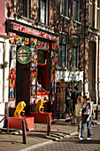 Coffeshop, Walletjes, Red Light District, People passing colourful coffeshop, Walletjes Red light district, , Amsterdam, Holland, Netherlands