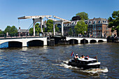 Leisure Boat, Magere Brug, Amstel, View over Amstel with leisure boat to Magere Brug Skinny Bridge, , Amsterdam, Holland, Netherlands