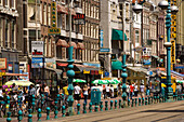 Souvenir Shops, Damrak, People walking over shopping street with a lot of souvenir shops, Damrak, Amsterdam, Holland, Netherlands