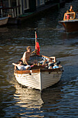 Leisure Boat, Brouwersgracht, Jordaan, Young men in leisure boat on Brouwersgracht, Jordaan, Amsterdam, Holland, Netherlands
