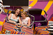 Girls in a fairground ride at Prater, Vienna, Austria