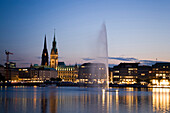 View over the Alster to the guildhall at dusk, Hamburg, Germany