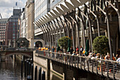 View along Alsterarkaden, People sitting in an open-air cafe of the Alsterarkaden, Hamburg, Germany