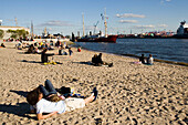 People relaxing at beach, People relaxing at Elbe beach, Oevelgönne, Hamburg, Germany
