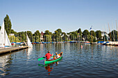 People in a canoe, People in a canoe near boat rental Bobby Reich at lake Alster, Hamburg, Germany