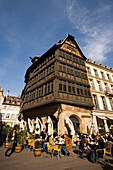 Place de la Cathedrale and Maison Kammerzell, View over a pavement cafe on Place de la Cathedrale Cathedral Square, to one of the oldest and loveliest timbered houses the Maison Kammerzell, Strasbourg, Alsace, France