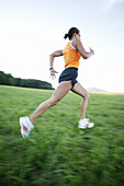 Young woman jogging in nature