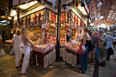 People at a stand for spices, People at a stand for spices in the Central Market Hall, Pest, Budapest, Hungary