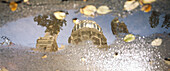 Reflection of the Neue Synagoge in an puddle, Oranienburger Street, Berlin, Germany