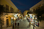 People strolling over shopping street with souvenir shops in the evening, old town, Kos-Town, Kos, Greece