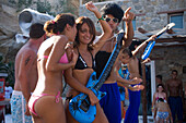 Young people amusing during a beach party of the Paradise Club, Paradise Beach, Mykonos, Greece