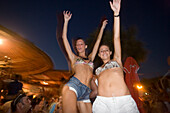 Young people dancing by the full moon party, Tropicana Club, Paradise Beach, Mykonos, Greece