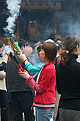 Longhua Temple,Longhua Temple and pagoda, oldest and largest buddhist temple in Shanghai, burning joss sticks, incense