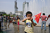 fountain, People's Square, Urban Planning Centre, public square, young boy with national flag