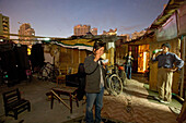 eating outside self-made huts from demolition material, Hongkou