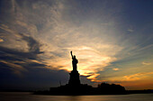 Sunset over the Statue of Liberty, New York, USA