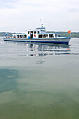 An excursion boat cruising on lake Starnberger See, Bavaria, Germany