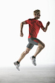 Runner, young man (20-25y) in motion