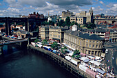 Aerial view over the River Tyne and Newcastle upon Tyne during Saturday market, Northumberland, England