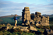 Hiker at Hound Tor, Dartmoor, Devon, England