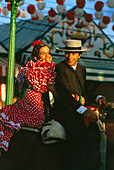 Paar auf dem Pferd,Feria de Abril,Sevilla,Andalusien,Spanien