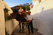 Farmer with child and donkey,Competa,white village,Province Malaga,Andalusia,Spain