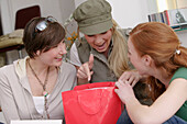 Young women with shopping bags