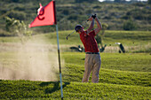 Golfer in Sand Trap, Apulia, Italy