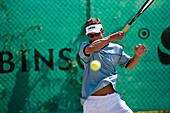 Man playing tennis, Apulia, Italy