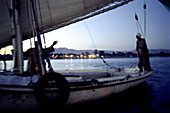 men on a sailing boat, nile, luxor, egypt