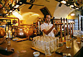 Barkeeper pouring beer, Hopfen Pub, Bolzano, Alto Adige, Italy