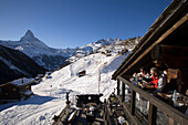 People sitting on terrace of Restaurant Chez Vrony, Design by Heinz Julen (2080 m), Findeln, Zermatt, Valais, Switzerland