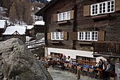 People resting on terrace of Restaurant Zum See, Zermatt, Valais, Switzerland