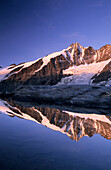 Grossglockner in the morning light with reflections in a mountain lake, Glockner range, Hohe Tauern national park, Carinthia, Austria