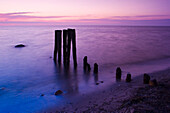 Groyne on beach in sunset light, Baltic Sea, Schleswig-Holstein, Germany