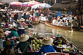 Tourists in wooden boats visiting the Floating Market, Damnoen Saduak, near Bangkok, Ratchaburi, Thailand