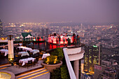 View over open air-bar Sirocco Sky Bar and Bangkok in the evening, State Tower, The Dome, Bangkok, Thailand