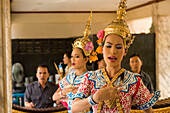 Traditional Thai dancers performing for Brahma, they dancing on request for donations, Erawan Shrine, Ratchadamri Road near Siam Square, Pathum Wan District, Bangkok, Thailand